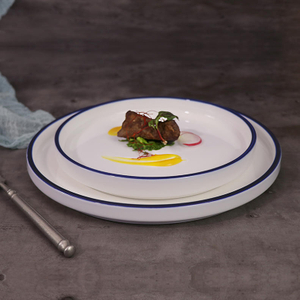 Hotel porcelain plate with blue rim detail