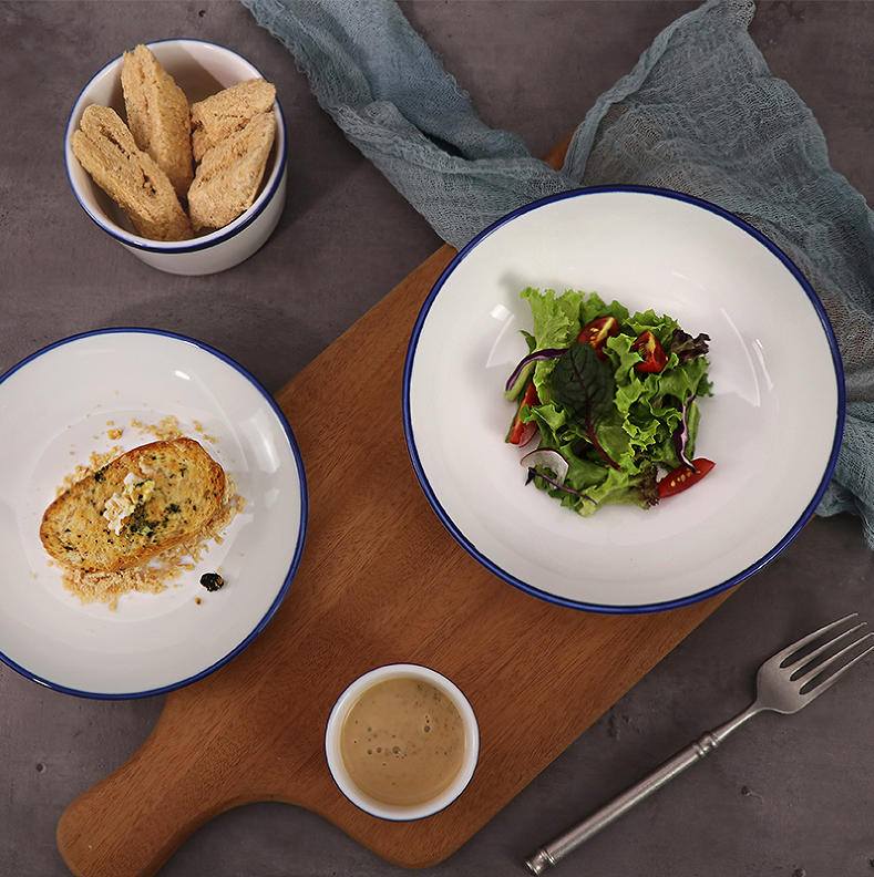 Commercial porcelain dinner plate with blue edge