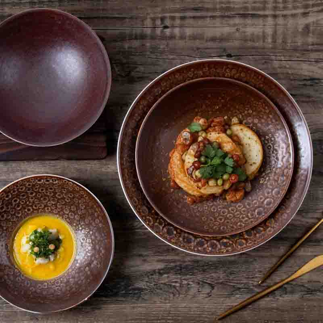 Upscale fine dining table layout highlighting mid-to-high tier ceramic tableware for premium catering and event planners
