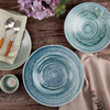 Vertically stacked vitrified ceramic tableware showcasing a calibrated flat foot profile for stable hotel storage