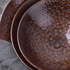 Micro shot of the reinforced rolled rim on durable ceramic tableware manufactured by an established ceramic plate factory