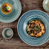 Close-up of the reinforced rolled rim on durable ceramic tableware to resist edge chipping in restaurants