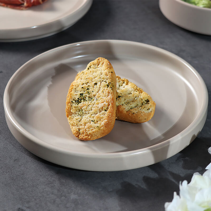 Hotel table setting with porcelain dinner plates